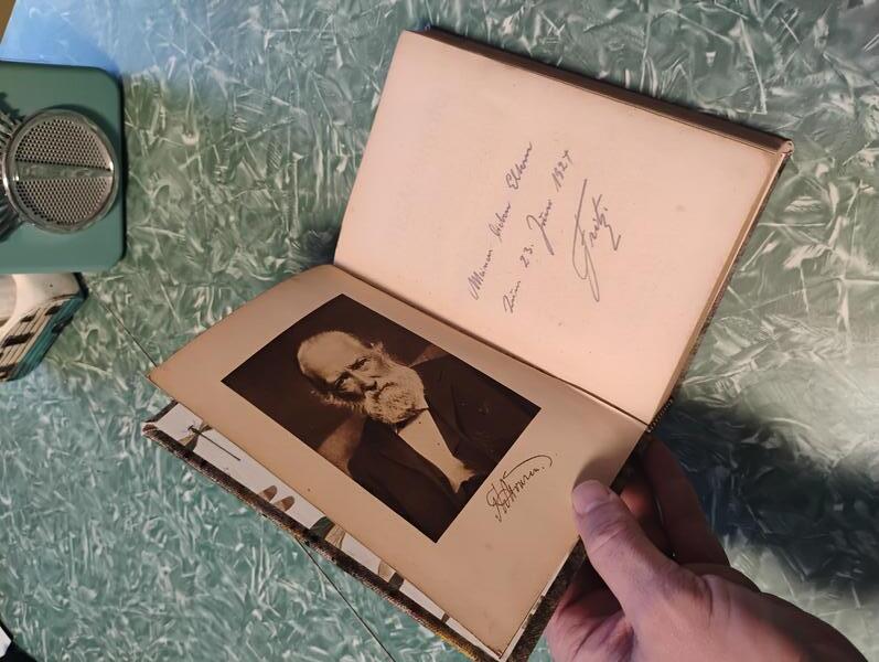 A photo of the book being worked on in this project. The book is titled 'Storms Werke' by Theodor Storm, a German writer. The book is open to the first page with a photo of Storm opposite the title page.