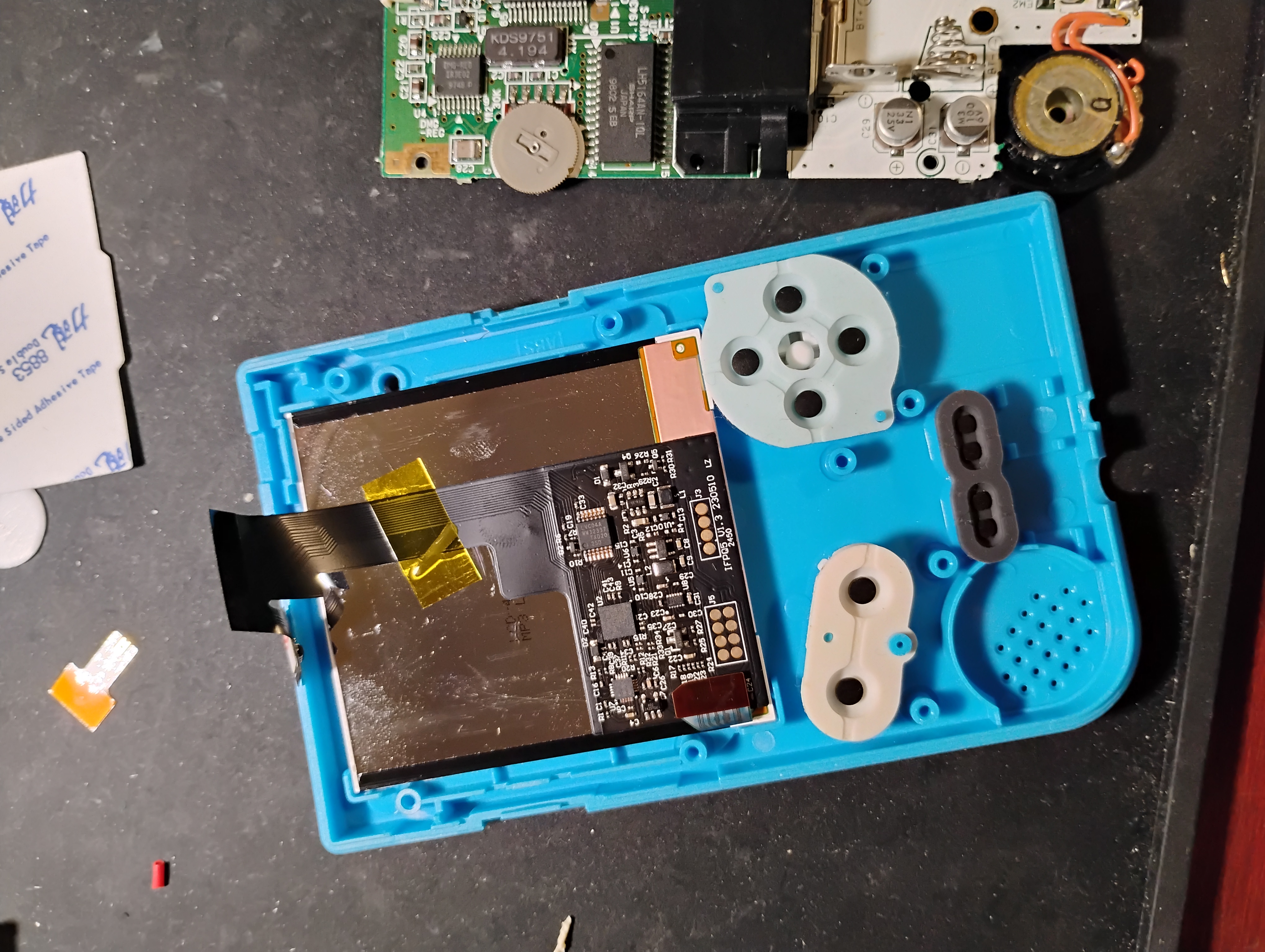 photo of my soon-to-be Game Boy Pocket with a fresh blue shell, clean button pads and a Q5 IPS display, ready to have the board dropped on